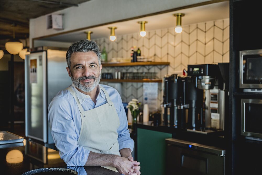 Smiling male business owner and barista