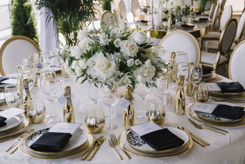 Wedding reception table elegantly set and ready for guests.