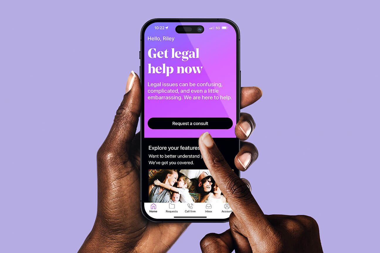 A hand using the LegalShield app on their phone