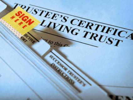 Trustee's Certificate Living Trust documents with a Sign Here sticker.