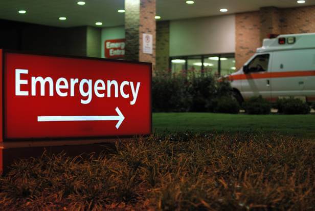 Hospital Emergency Room sign and ambulance.