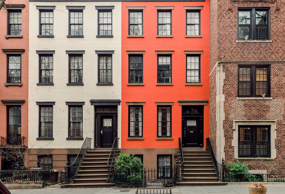 Row of 3-story brick homes and Airbnb rentals