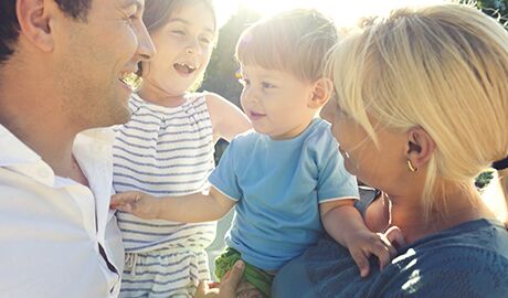 Happy young family of four