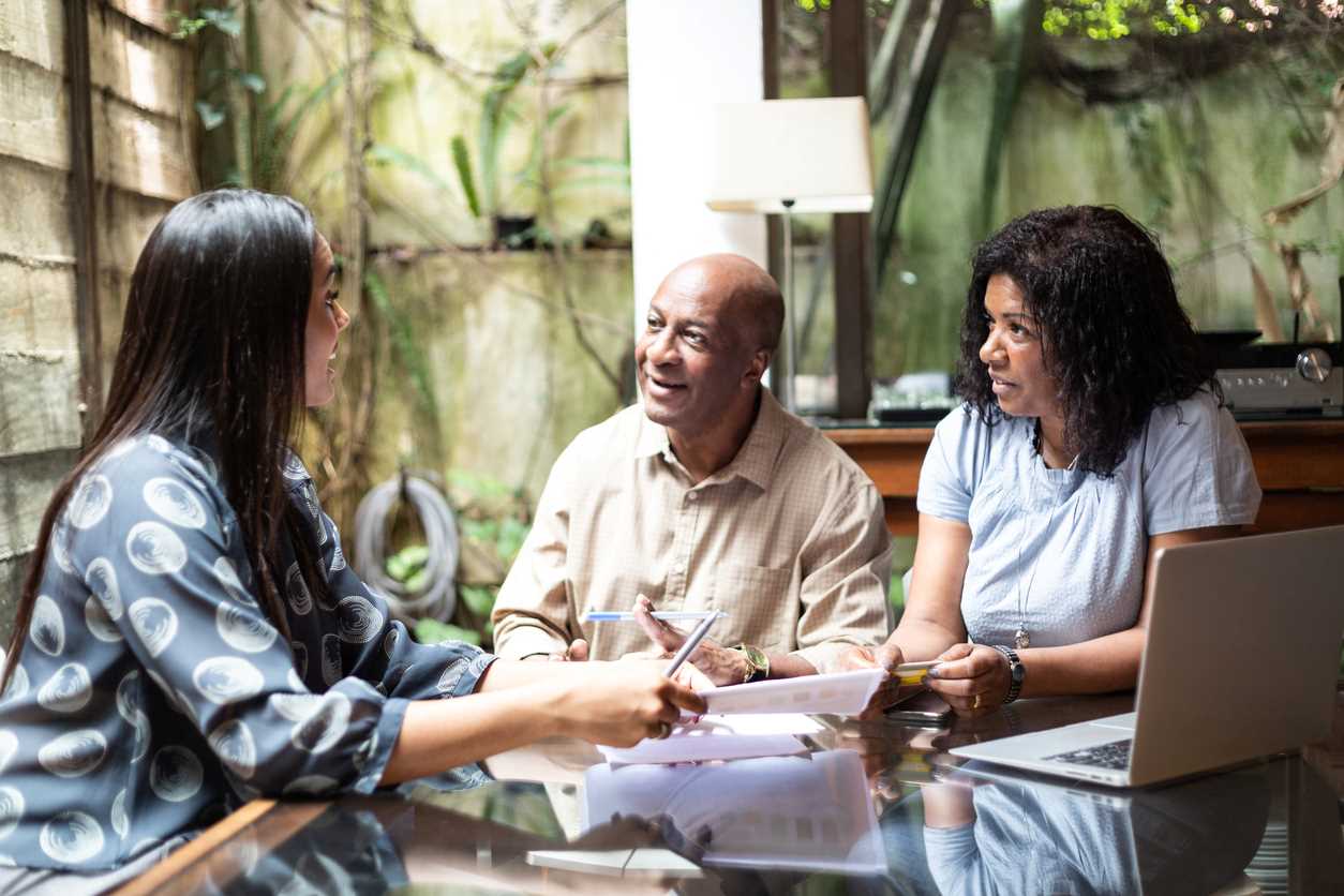 Lawyer discussing the types of Power of Attorney legal documents with a couple