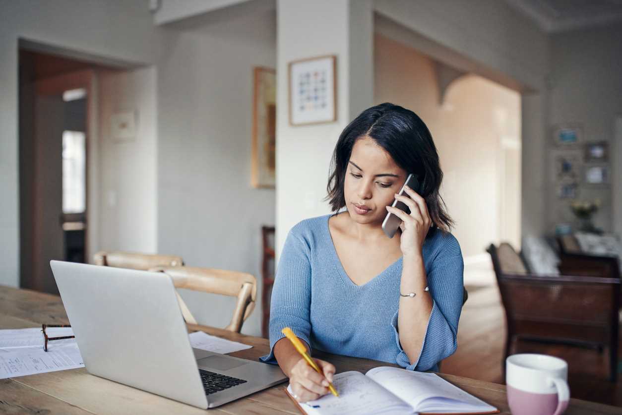 Small business owner discussing debt collection on smartphone