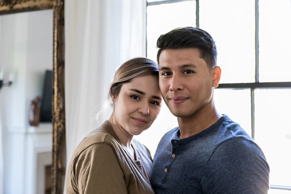 Young loving couple standing close