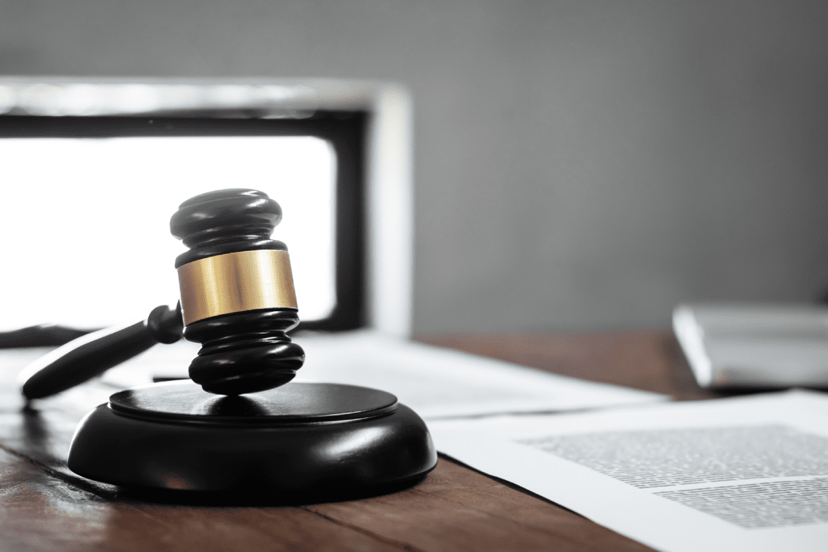 Courtroom judge's gavel on desk with prenuptial agreement