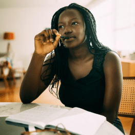 Woman contemplating the needs of her home business.