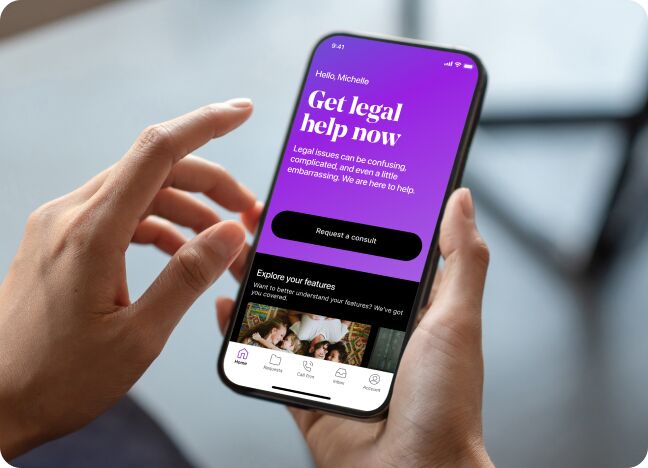 Woman looking at LegalShield app Get legal help now screen on her phone.