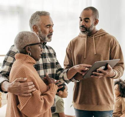 Son explaining elder law to elderly parents.