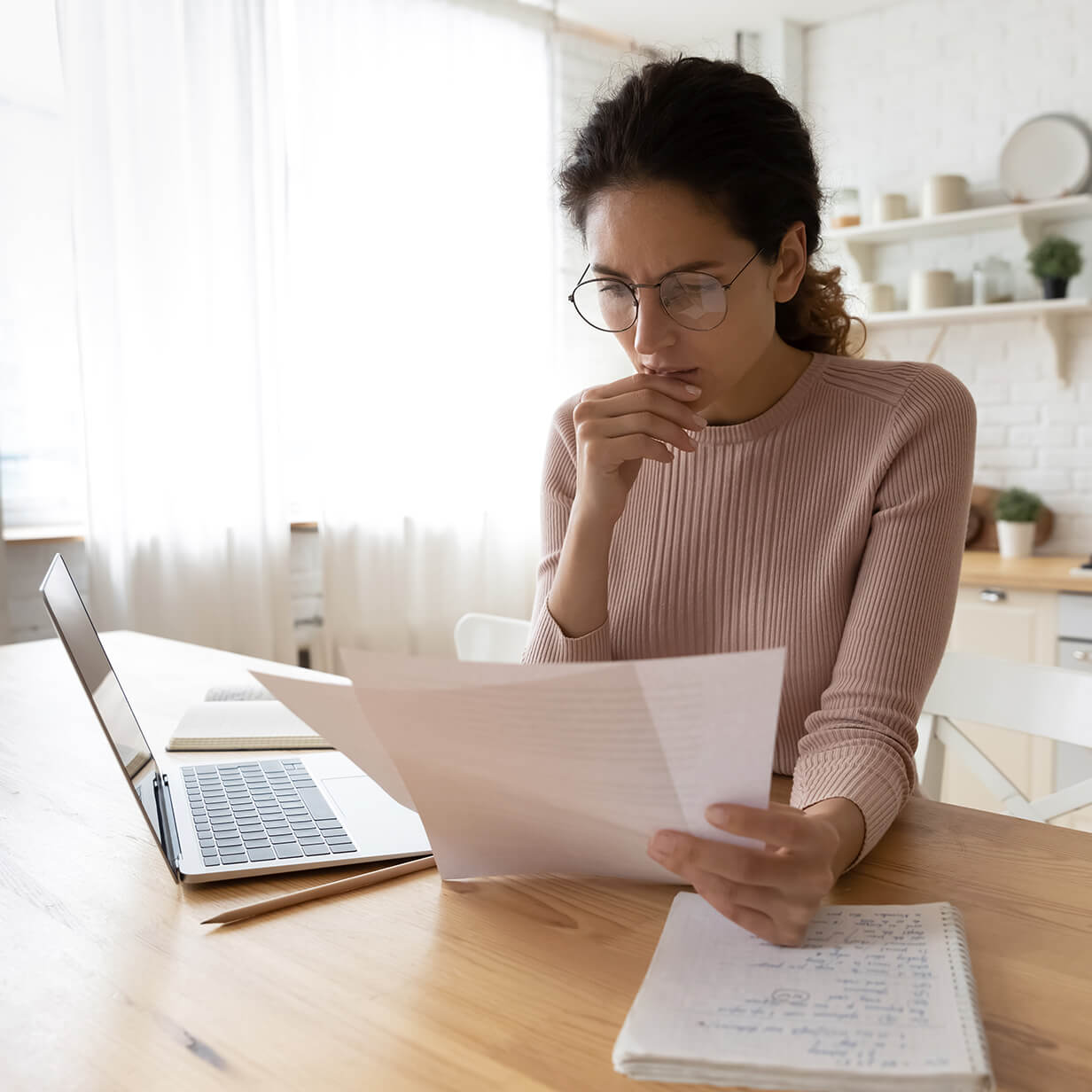 Woman reviewing a lease termination checklist.