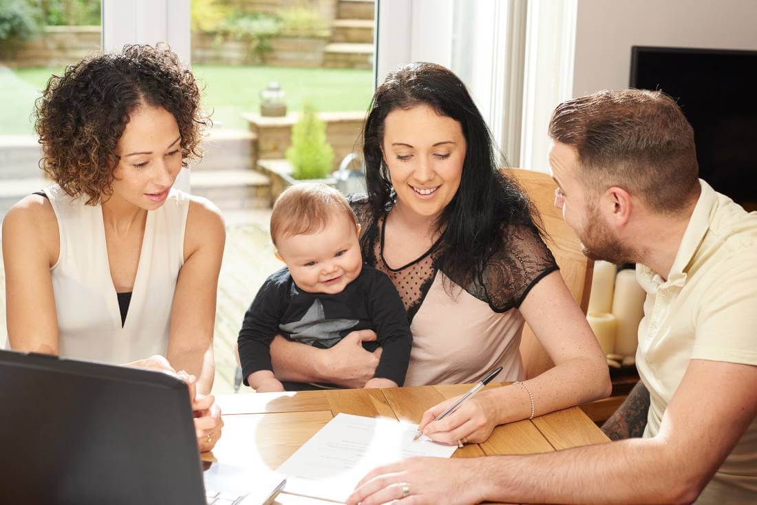 Mother signing a daycare contract