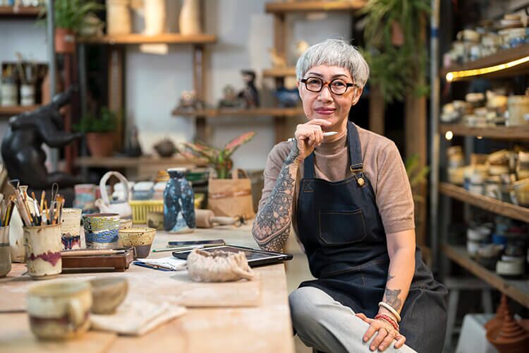 Small business owner in her pottery workshop.