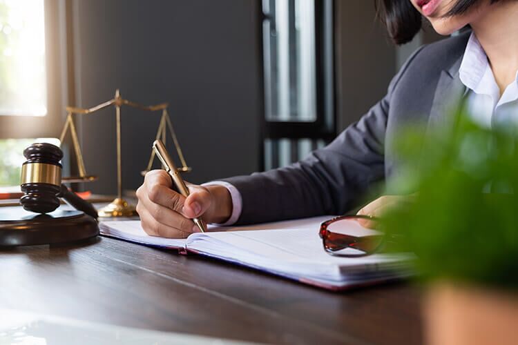 Contract lawyer working at her office desk.