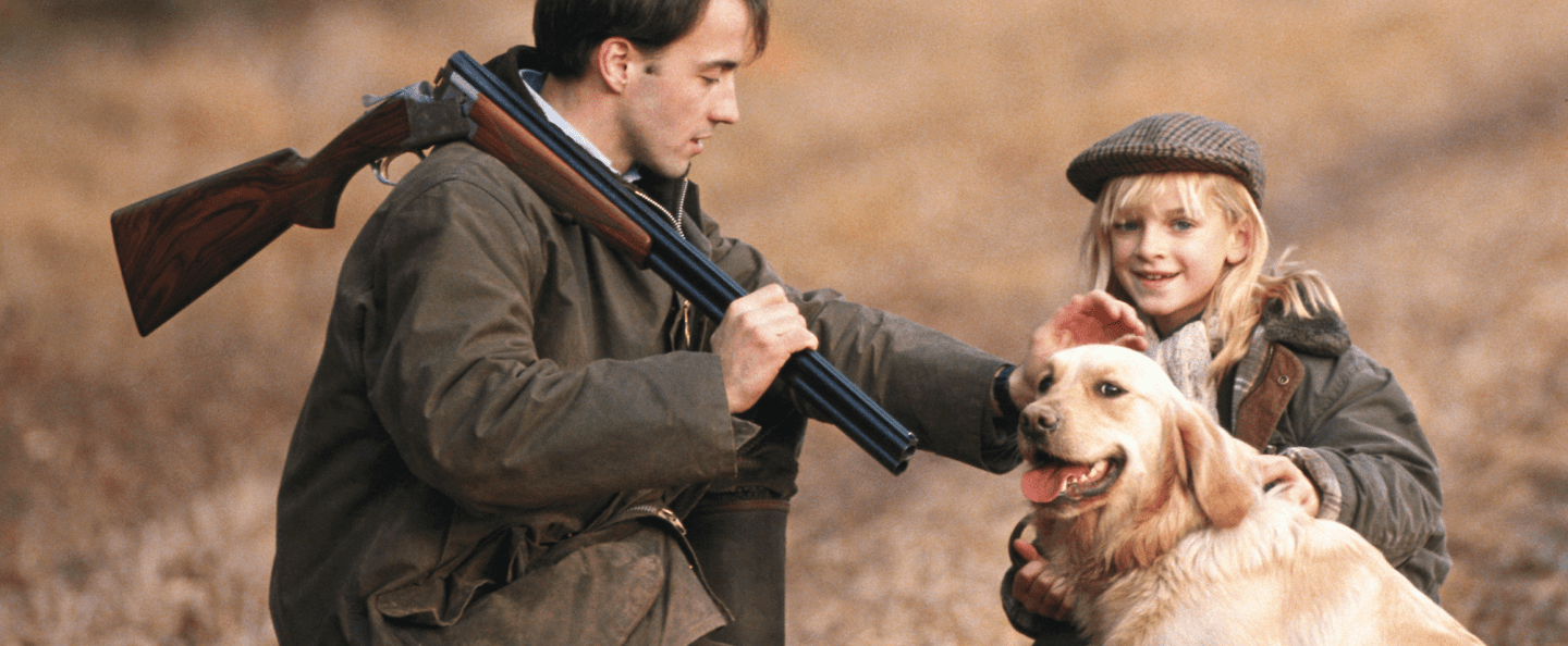 Gun owner with dog and young child