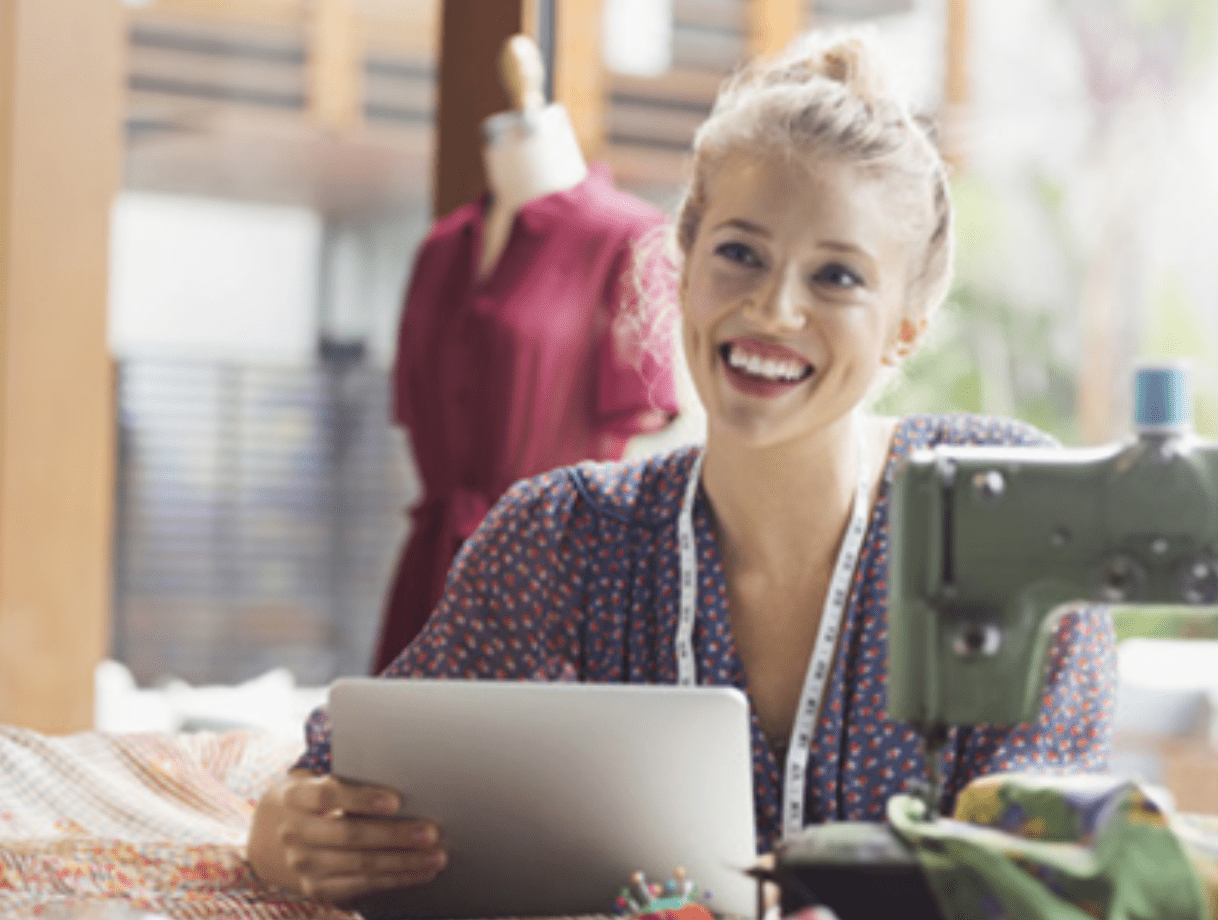 Seamstress working and smiling