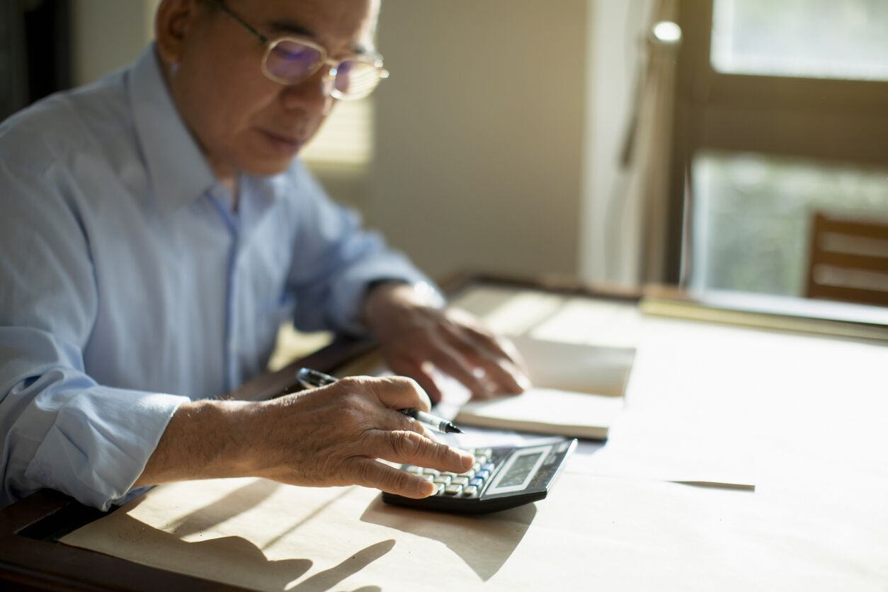 Mature man calculating his U.S. taxes