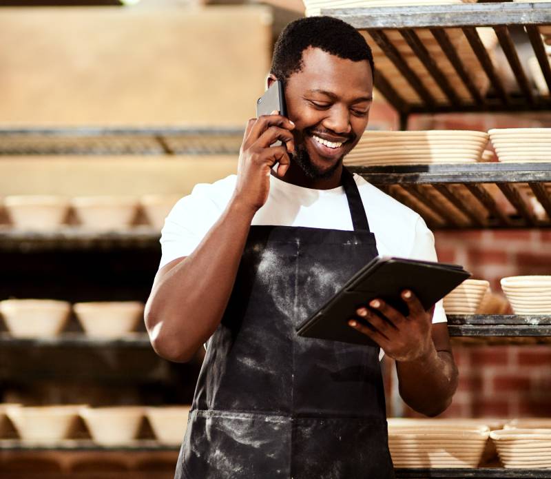 Business owner talking to lawyer on the phone about tax deduction