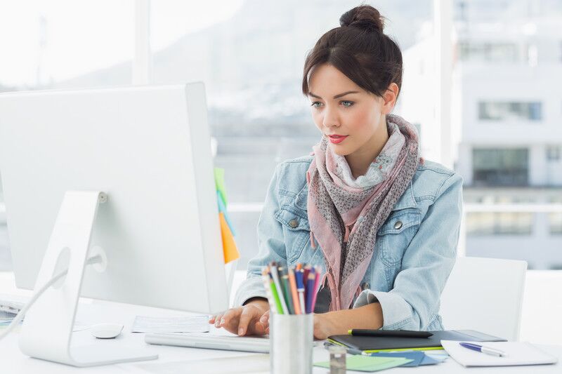 Woman working at her desk on a computer