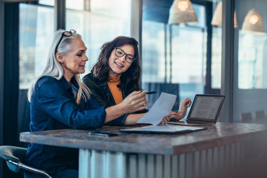 Female business partners reviewing business formation options