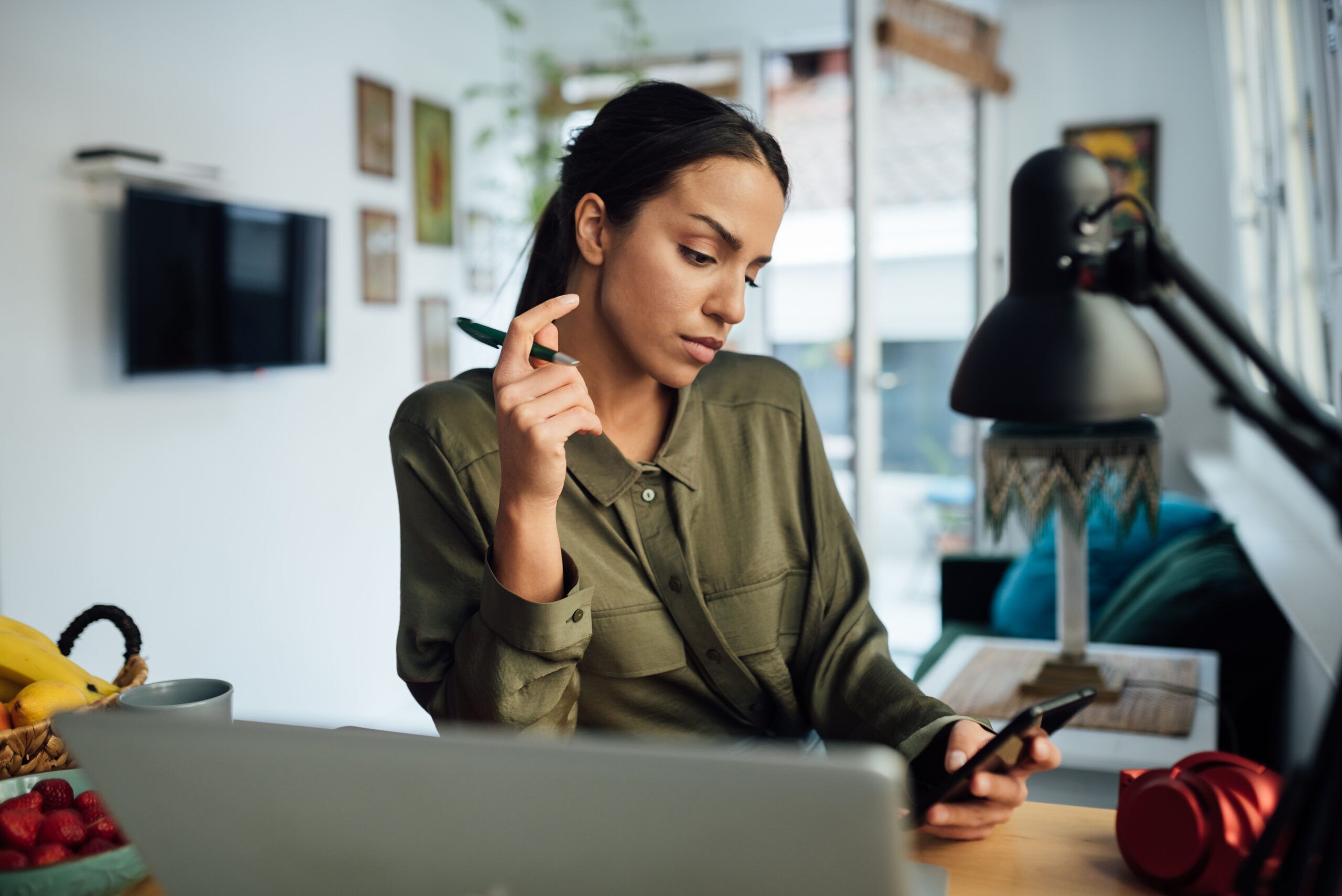 Woman reviewing LLC & DBA options on smartphone