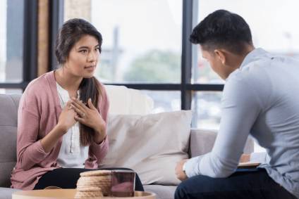 Young couple discussing the need for a prenuptial agreement