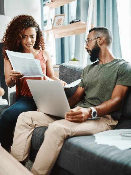 Couple discussing legal documents for women's marriage name change.