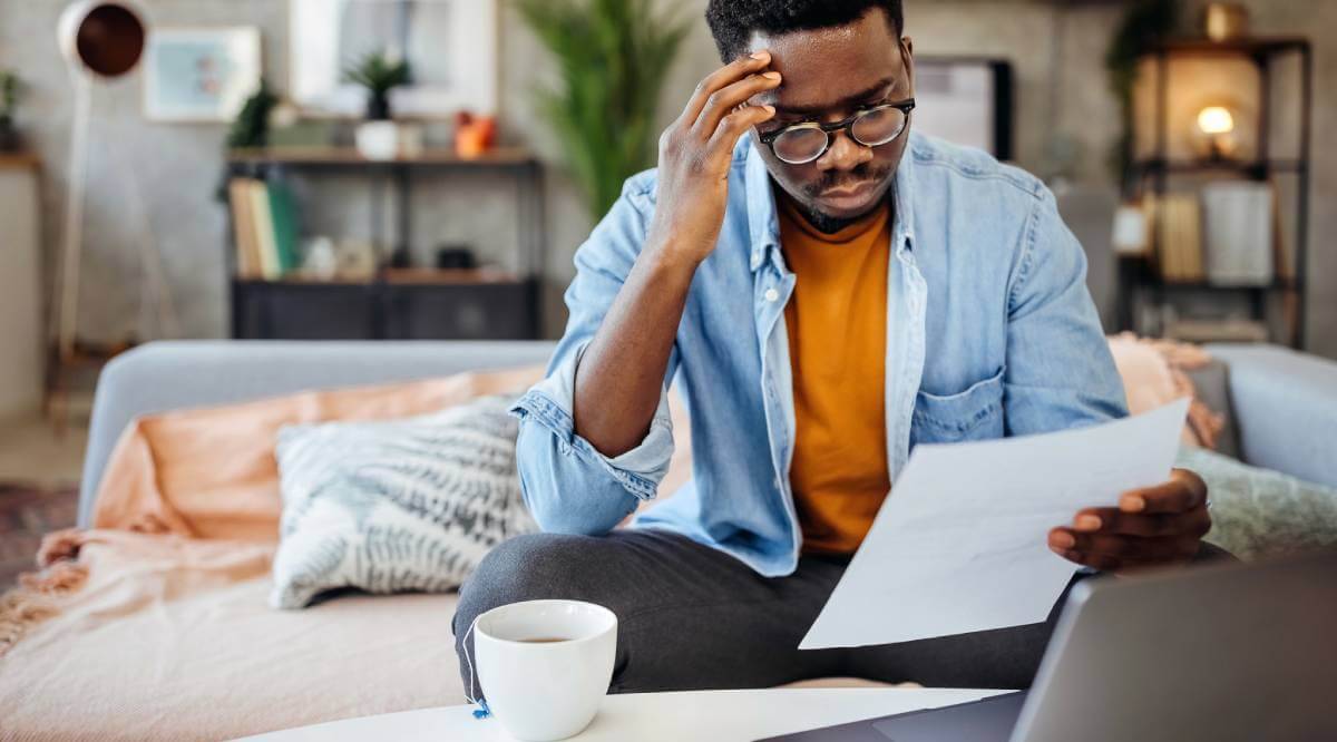 Man reviewing a student loan forgiveness document.