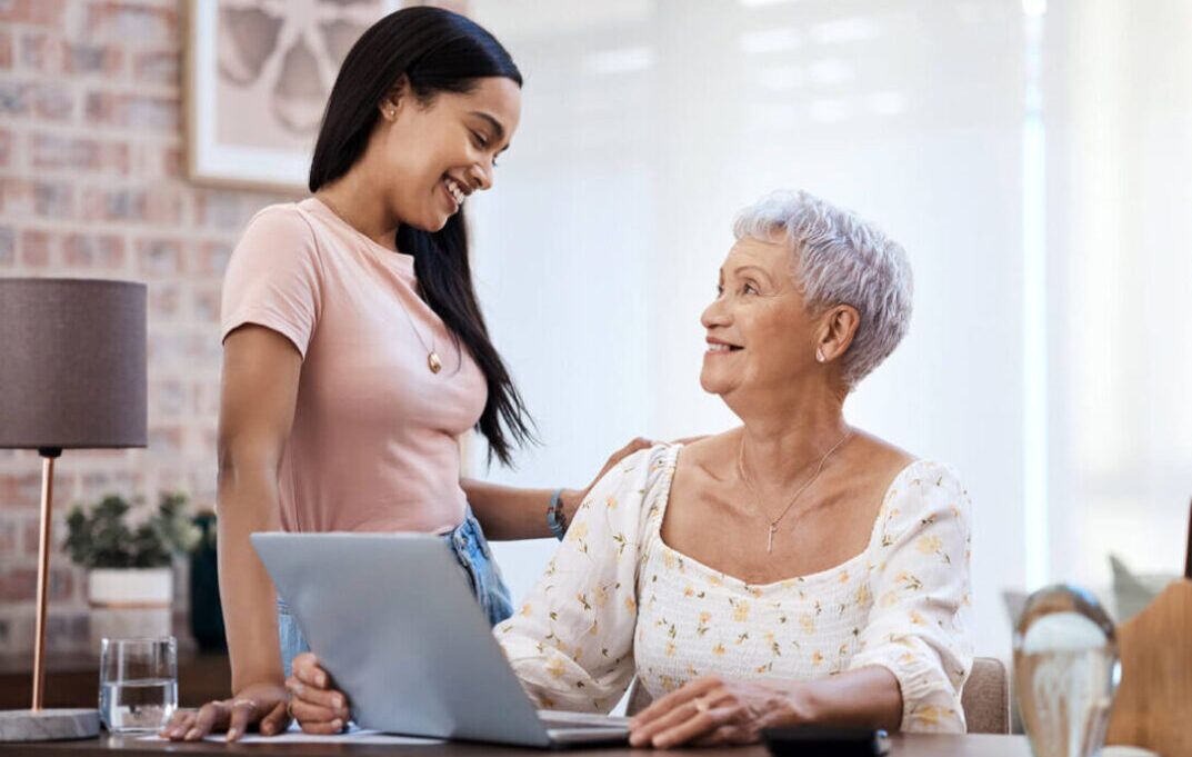 Mature woman talking to a younger female family member.