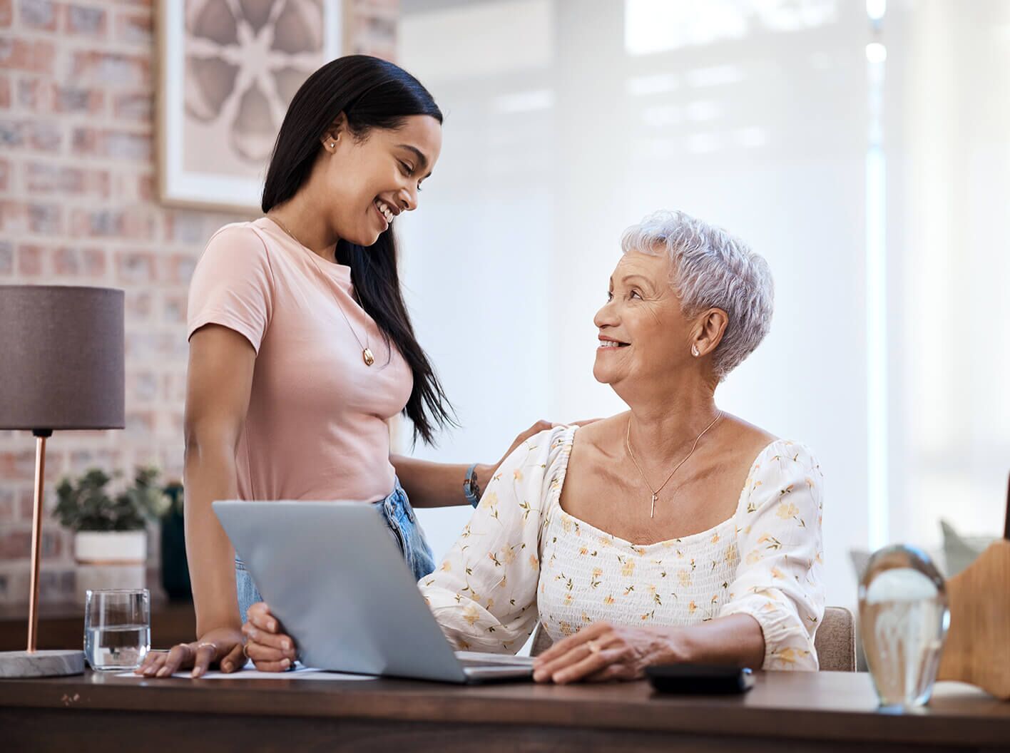 Mature woman talking to a younger female family member.