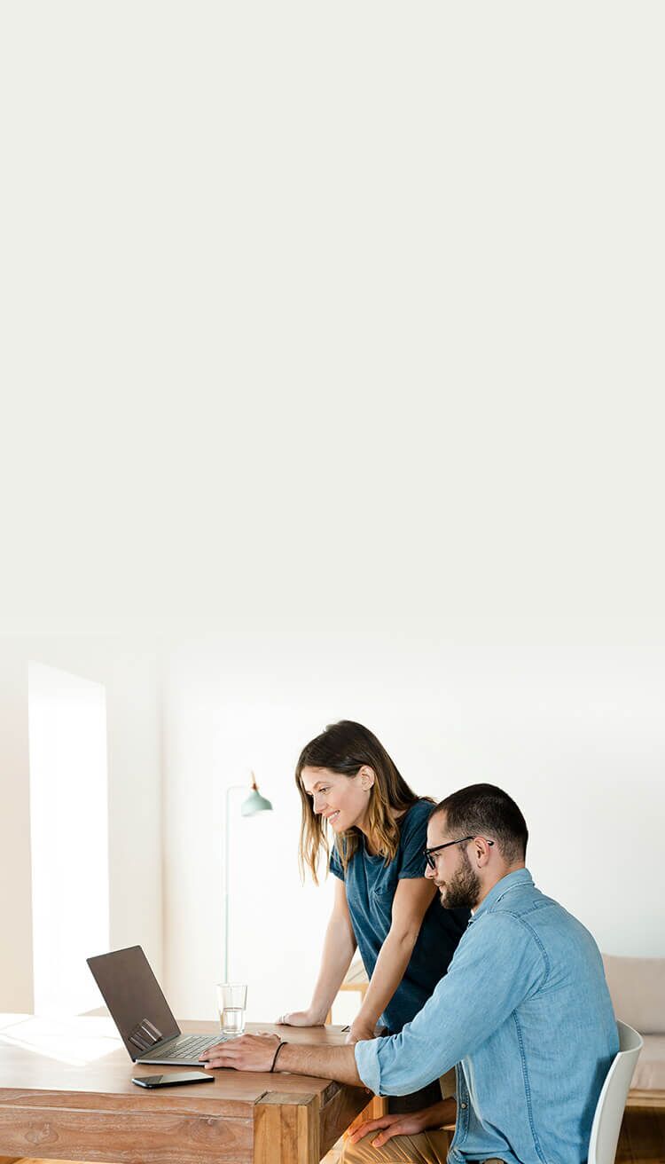 Couple reviewing LegalShield Personal Legal Plan Supplements on a laptop.