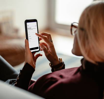 Woman writing a Will using the LegalShield app.