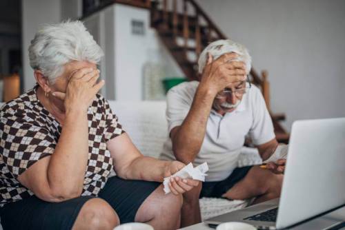 Worried couple concerned about elder abuse.